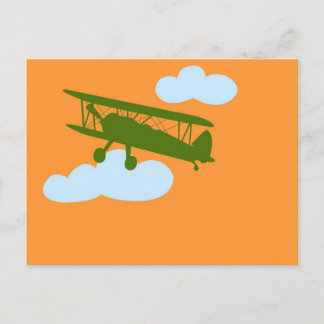 Airplane on plain orange background. postcard
