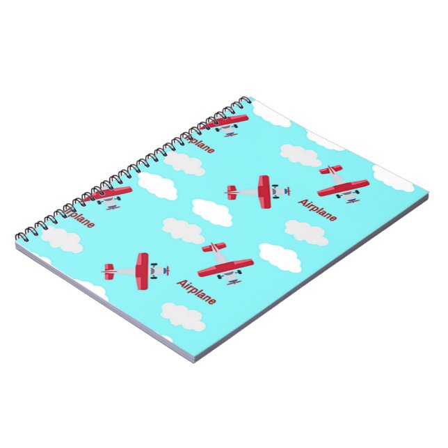Airplane pattern on blue notebook (Left Side)