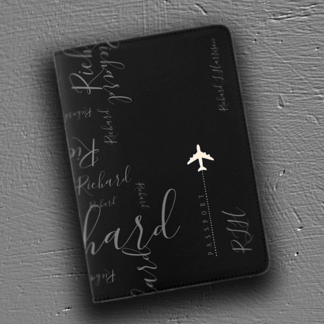 airplane travel handwritten name pattern on black passport holder (Creator Uploaded)