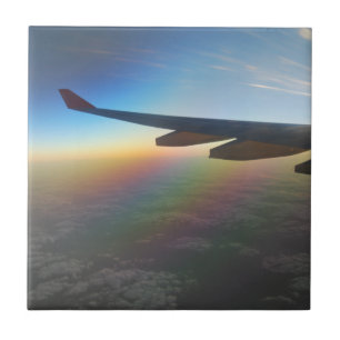 Airplane Wing against Colorful Setting Sun Tile