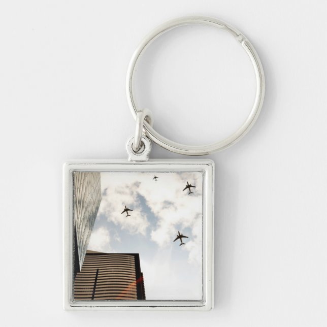 Airplanes flying over buildings keychain (Front)
