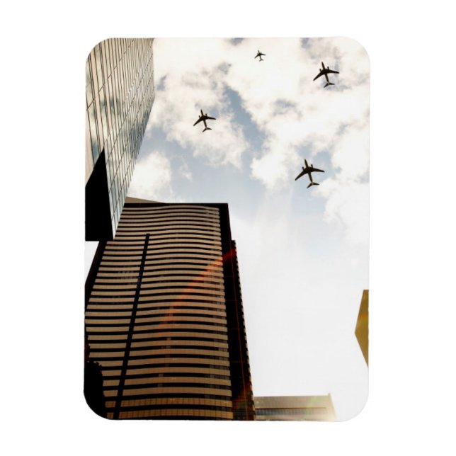 Airplanes flying over buildings magnet (Vertical)