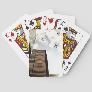 Airplanes flying over buildings poker cards