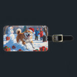 Akita Christmas Festive Snow Scene  Luggage Tag<br><div class="desc">A heartwarming holiday illustration featuring a cheerful dog playing in the snow,  wearing a Santa hat and surrounded by colorful gift boxes. In the background,  children build a snowman beside a snow-covered Christmas tree,  creating a joyful winter wonderland. Perfect for spreading holiday cheer and capturing the magic of Christmas.</div>