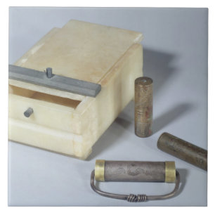 Alabaster box and bronze and silver seal cylinders ceramic tile