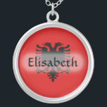 Albania Flag Name Necklace<br><div class="desc">The design for this attractive pendant features a name overlying the Albanian flag, which has been neatly morphed to fit the round shape. The featured name can be changed to any name or text of your choice, creating a personalized gift for someone who loves Albania.
© 2011 FlagAndMap</div>
