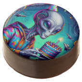 Alien holding Birthday Cake Chocolate Covered Oreo (Angled)
