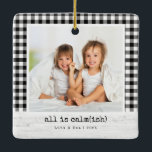 All Is Calm(ish) • Buffalo Check Photo Christmas Ceramic Ornament<br><div class="desc">A cozy, tongue-in-cheek holiday ornament for real families—because things are calm… ish. This square photo ornament features a classic black-and-white buffalo check frame, a whitewashed wood caption bar, and the playful headline “all is calm(ish).” Swap in your photo, update names and year, and you’ve got a stylish keepsake that fits...</div>