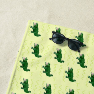 Alligator on yellow beach towel