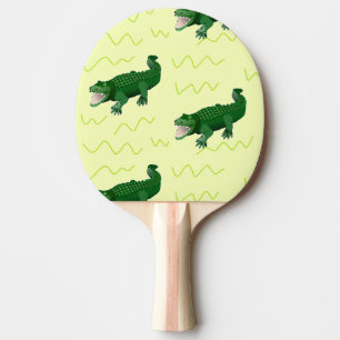 Alligator on yellow ping pong paddle