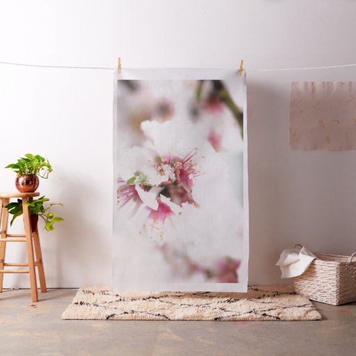 Almond tree flowers covered by snow fabric