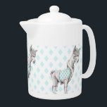 Alpaca Teapot<br><div class="desc">Whimsical drawing of an alpaca wearing boots and a vest with a turquoise diamond pattern against a pale turquoise diamond pattern background. A lovely illustration for animal lovers and those who love a warm,  fuzzy feeling!
Copyright © Mariana Musa for Floating Lemons. All rights reserved.
http://www.floatinglemons.com
http://www.floatinglemonstreats.com</div>