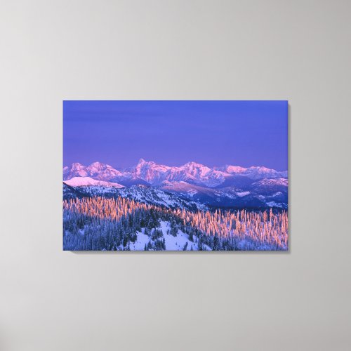 Alpenglow strikes the peaks of Glacier Canvas Print