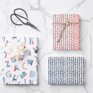 Alphabet in red blue white wrapping paper sheets