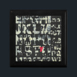 Alphabet Painting by Norman Wyatt Gift Box<br><div class="desc">If you love taking vision exams then this painting is for you! The letter of the english alphabet are imposed over each other,  almost obscuring them in this painting by Norman Wyatt. The letter Y stands out thanks to its pink coloration.</div>