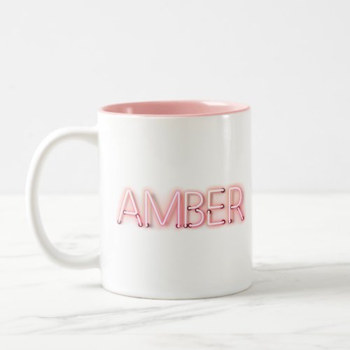 Amber name in glowing neon lights novelty Two_Tone coffee mug