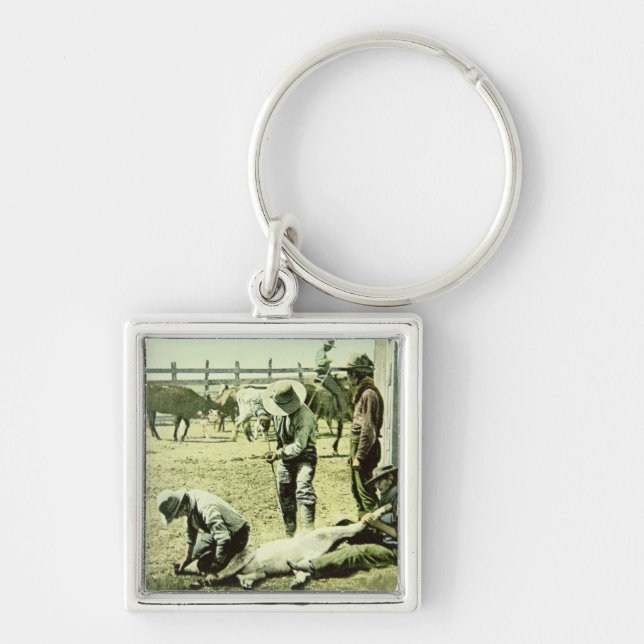 American cowboys branding a calf, c.1900 (photo) keychain (Front)