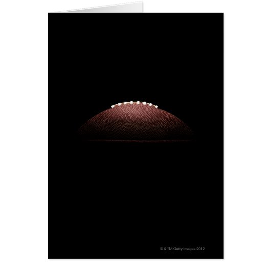 American football ball on black background (Front)