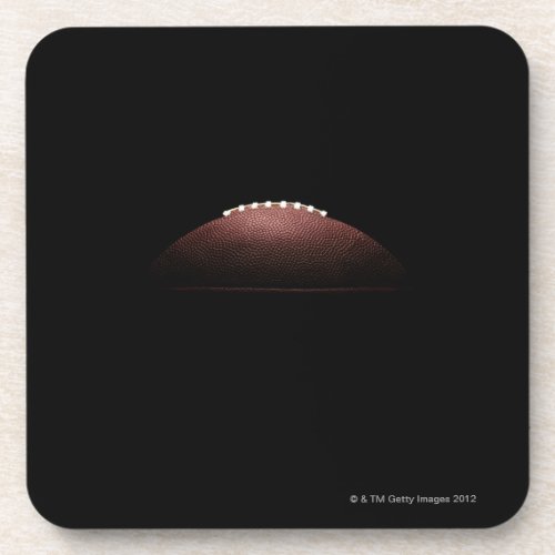 American football ball on black background coaster