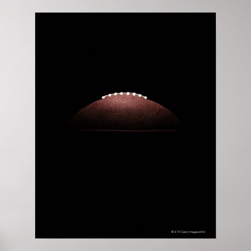 American football ball on black background poster