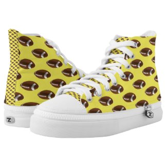 American football balls on yellow