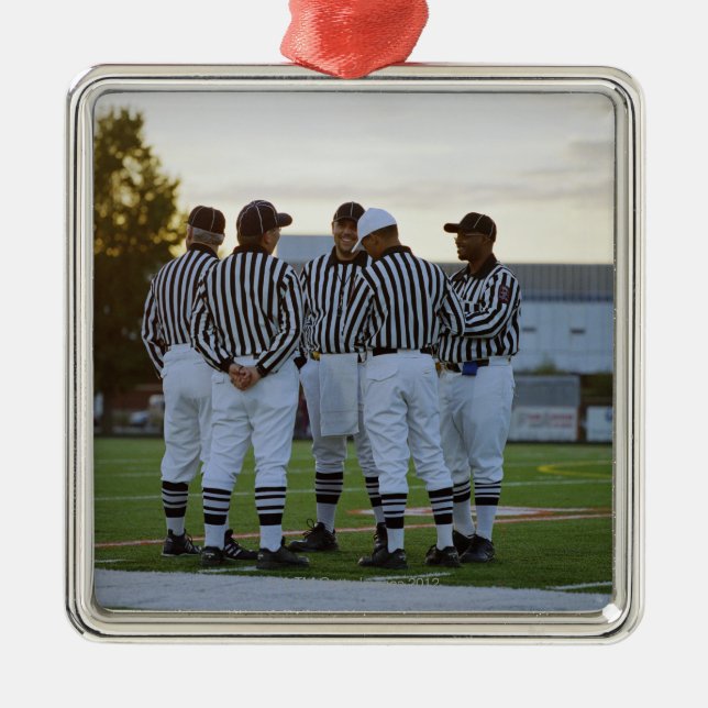 American football referees talking in field metal ornament (Front)
