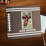 American Football Sport Portrait Photo Scrapbook 3 Ring Binder<br><div class="desc">Enjoy this really customizable American football themed scrapbook album!  Personalize with a portrait photo and name on front,  and jersey number on back.  Brown photo leather background with double white stripes across top and bottom,  and laced spine.</div>