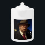 American President Donald Trump Godfather Teapot<br><div class="desc">The Godfather of America: The Don Trump - In a twisted version of America, where democracy had long since been traded for iron-fisted rule, one man stood above all others—a figure whose name was whispered with a mix of fear, reverence, and awe. He was not just a ruler; he was...</div>