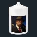 American President Donald Trump Godfather Teapot<br><div class="desc">The Godfather of America: The Don Trump - In a twisted version of America, where democracy had long since been traded for iron-fisted rule, one man stood above all others—a figure whose name was whispered with a mix of fear, reverence, and awe. He was not just a ruler; he was...</div>