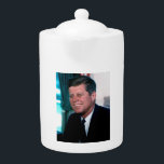 American President John F. Kennedy in Oval Office Teapot<br><div class="desc">The Oval Office became John F. Kennedy's command center during his tumultuous presidency. Stepping away from the grandiosity of previous presidents, JFK preferred a more intimate setting for meetings and decision-making. The iconic image of him rocking in his rocking chair, gifted by a rocking chair manufacturer during his campaign, became...</div>
