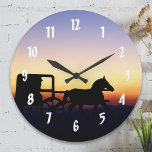 Amish Horse and Buggy Wall Clock<br><div class="desc">A silhouette of an Amish man driving a horse and buggy travels down a country road at sunset. The purple,  orange and blue hues of the evening sky are a beautiful backdrop for this plain living scene.</div>