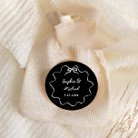 Amour | Black Illustrated French Bow Wedding Classic Round Sticker<br><div class="desc">This chic and elegant wedding favor sticker features a hand drawn,  wavy illustrated frame with a bow,  and stylish handwritten script for a Parisian or French style wedding invitation. This classic color option is dark black and ivory.</div>