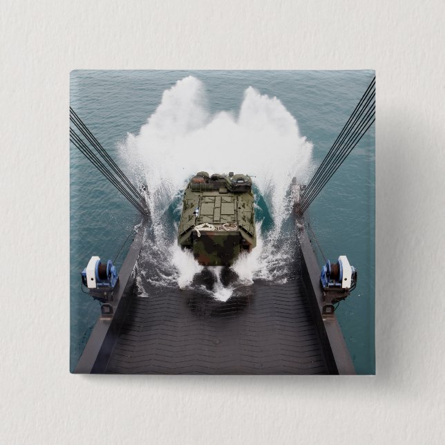 Amphibious assault vehicles disembark from USNS Button (Front)