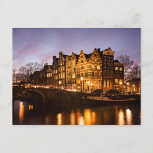 Amsterdam canal houses at dusk postcard