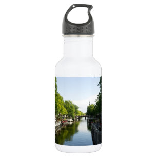 Amsterdam Canal with Houseboats and Lush Trees Water Bottle