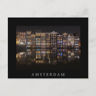 Amsterdam houses with colorful lights in the night postcard