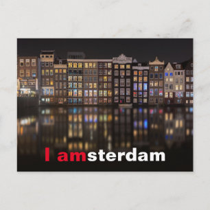 Amsterdam houses with colorful lights in the night postcard