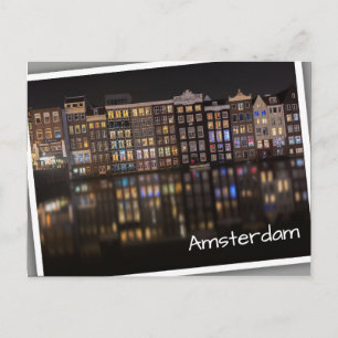 Amsterdam houses with colorful lights in the night postcard
