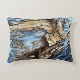 An abstract texture in light brown and blue tree b accent pillow