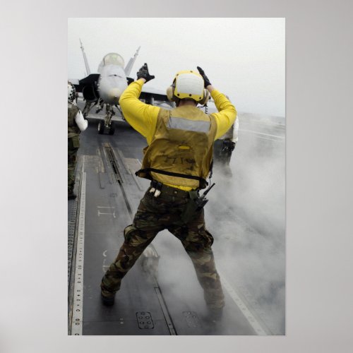 An aircraft director signals a FA_18C Hornet Poster