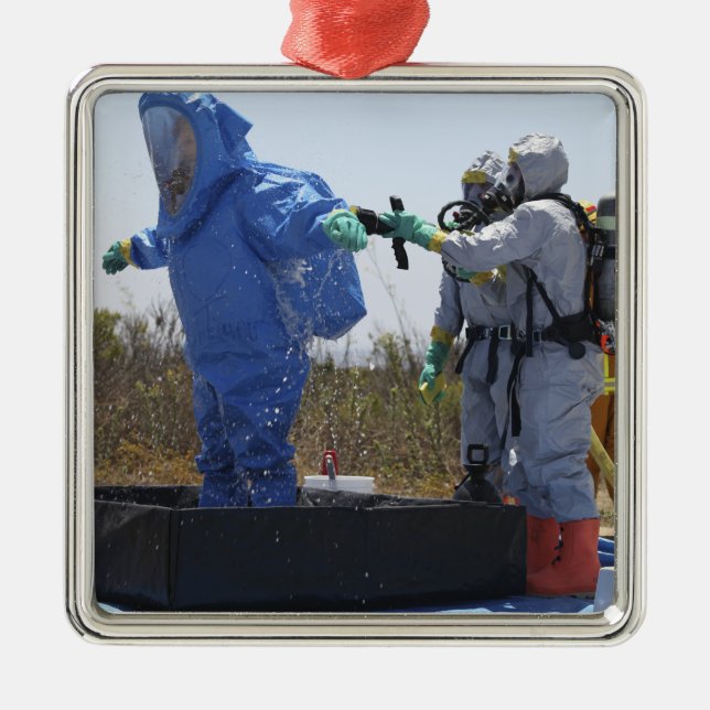 An airman stands in a tub metal ornament (Front)