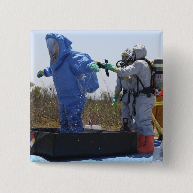 An airman stands in a tub pinback button (Front)