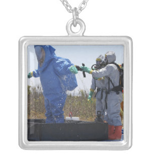 An airman stands in a tub silver plated necklace