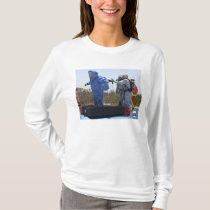 An airman stands in a tub T-Shirt