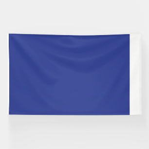 an airplane flying in the sky with a blue backgrou banner