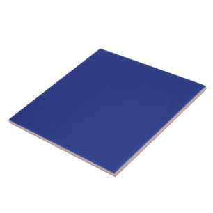 an airplane flying in the sky with a blue backgrou ceramic tile