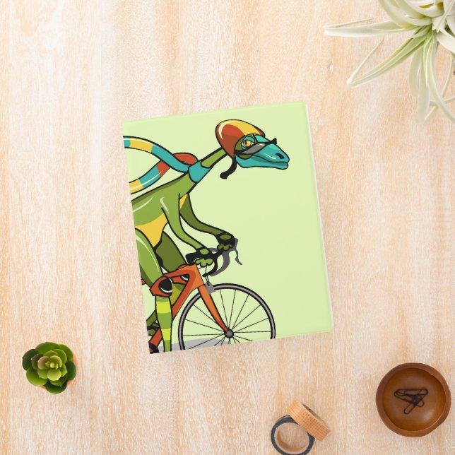 An Anabisetia Dinosaur Riding A Bicycle. Mini Binder (InSitu)