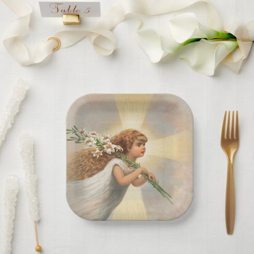 An angel in the sky holding lilies christmas  paper plates