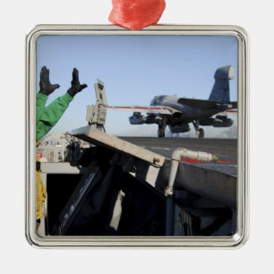 An EA-6B Prowler launches from the flight deck Metal Ornament