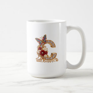 An elegant gold balloon in the shape of the letter coffee mug